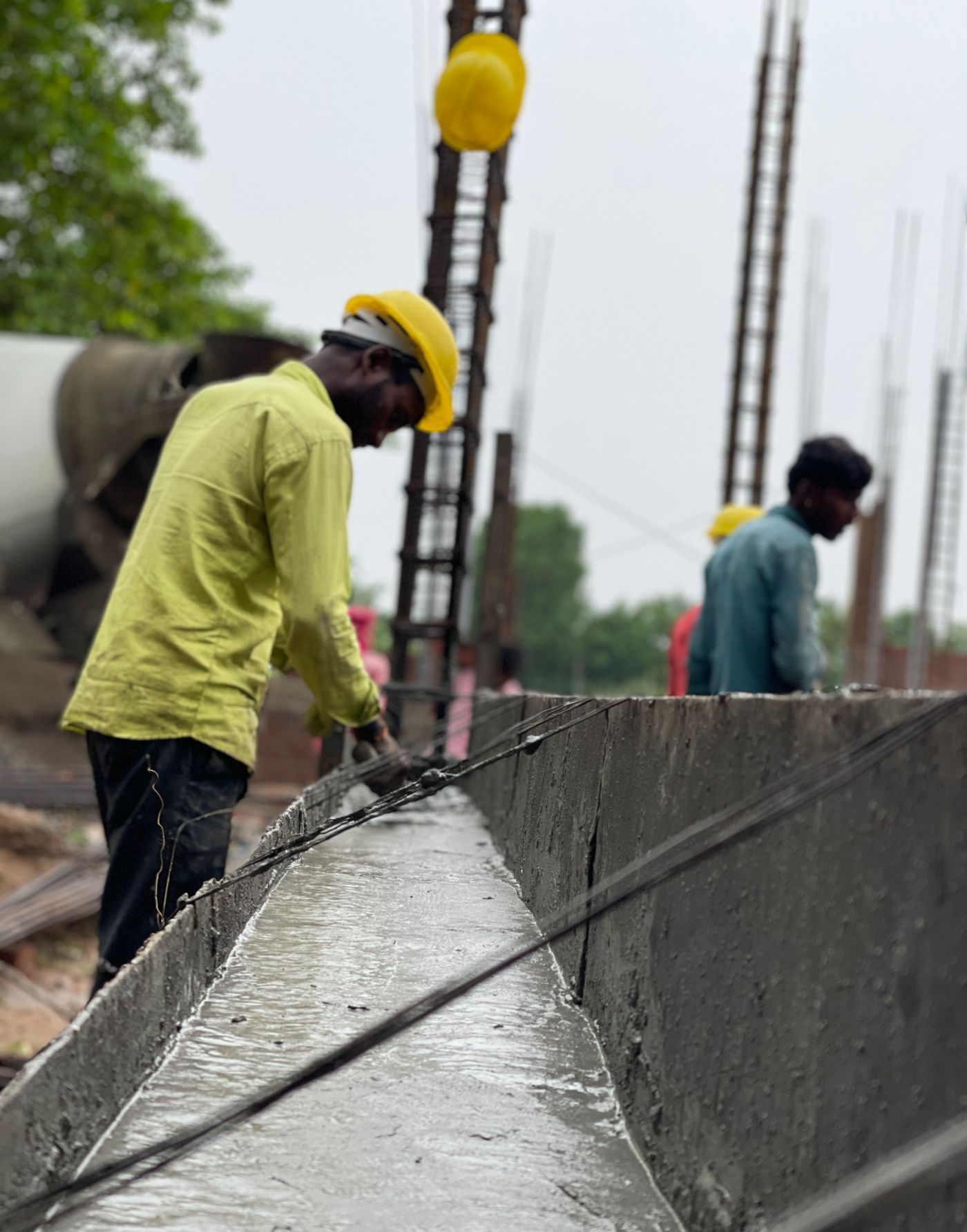 Crew working on a concrete pour at a job site